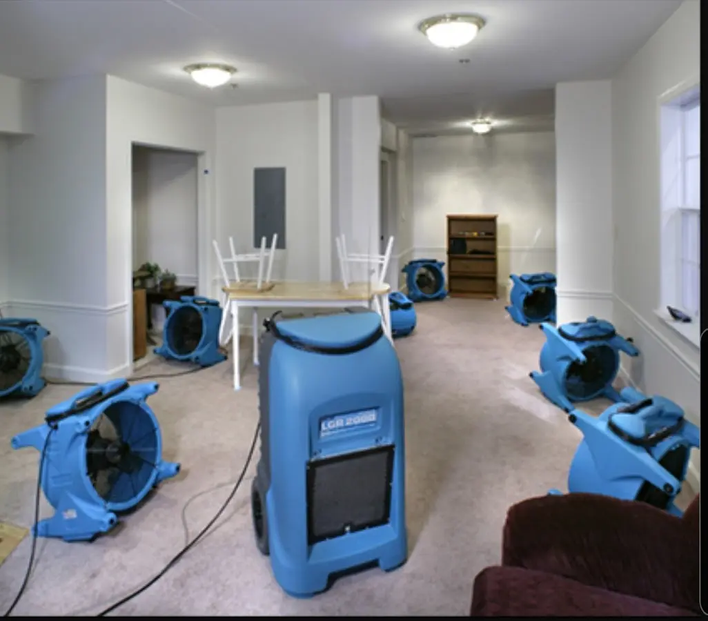 Air movers and dehumidifier setup for Water Damage Restoration in Versailles